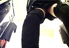 Upskirt of Asian Girl on phone in Clothes Store