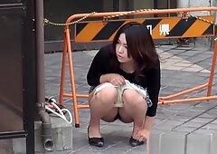 Peeing asian uses panties