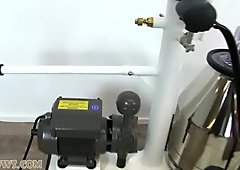 Two hotties tied up together with a torture device