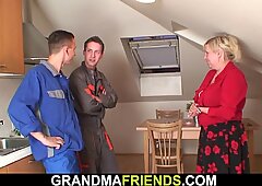 Busty old grandma spreads legs for two repairmen