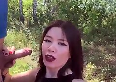 Asian girl loves from behind in the forest
